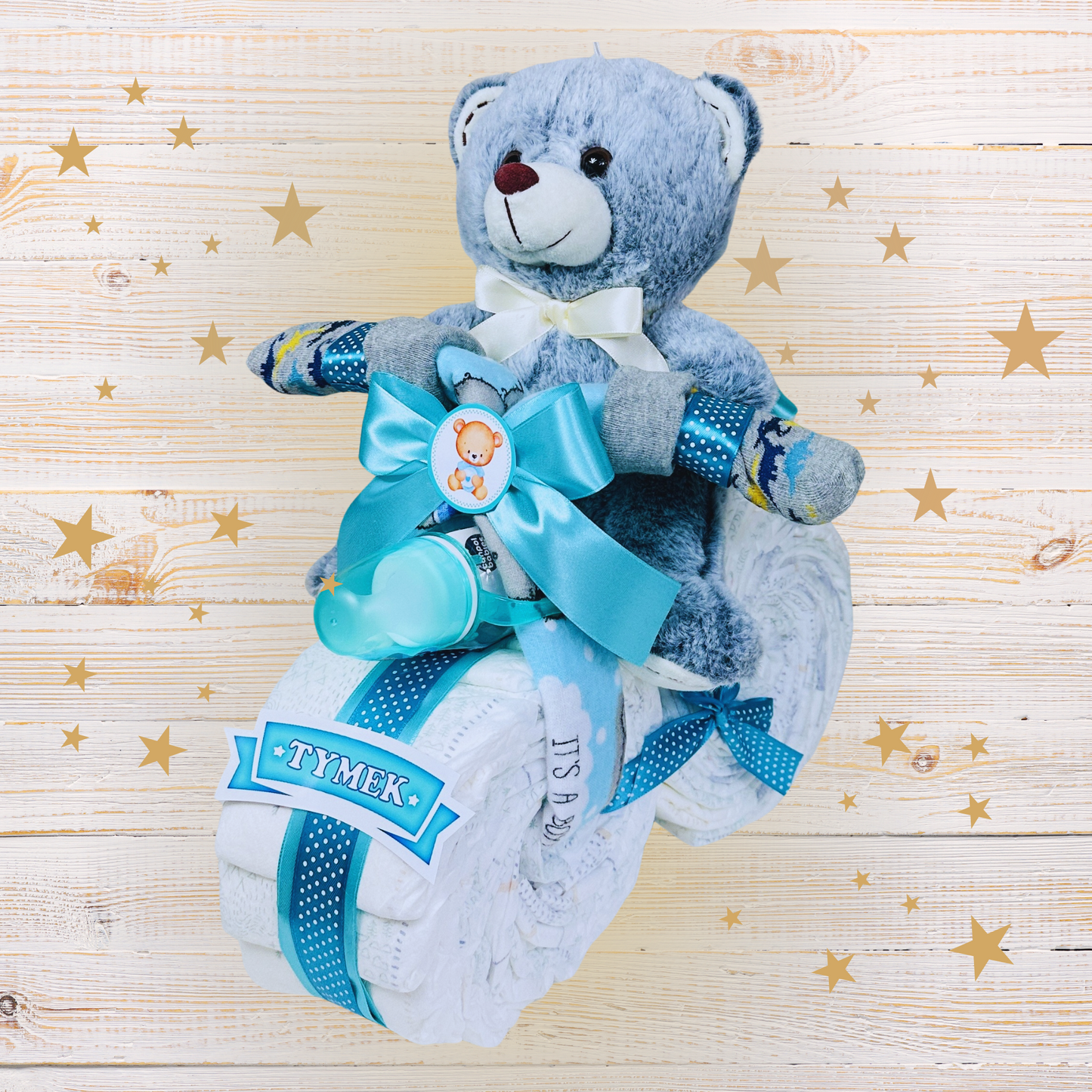 Niebieski motor z pieluch szary miś